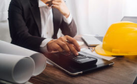 hard hat on a man's desk