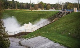 水runs over Edenville Dam