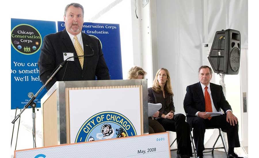HNTB's Tim Faerber speaks to a government audience in 2008 with former Chicago Mayor Richard M. Daley in attendance.
