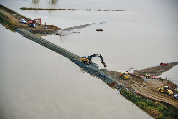 crews repairing levee